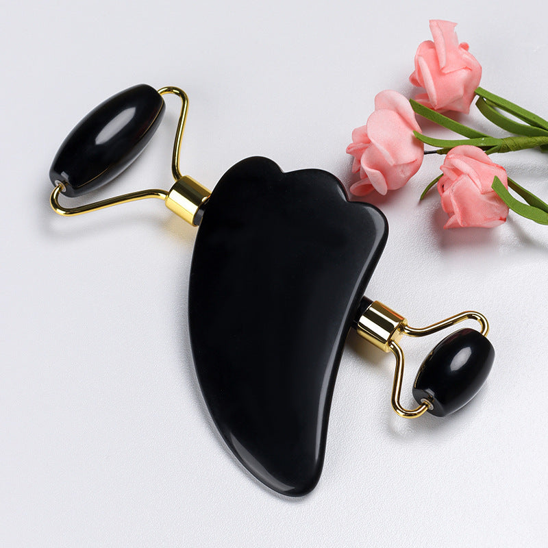 Black obsidian jade roller and gua sha set displayed side by side – ideal for natural facial massage and self-care rituals.