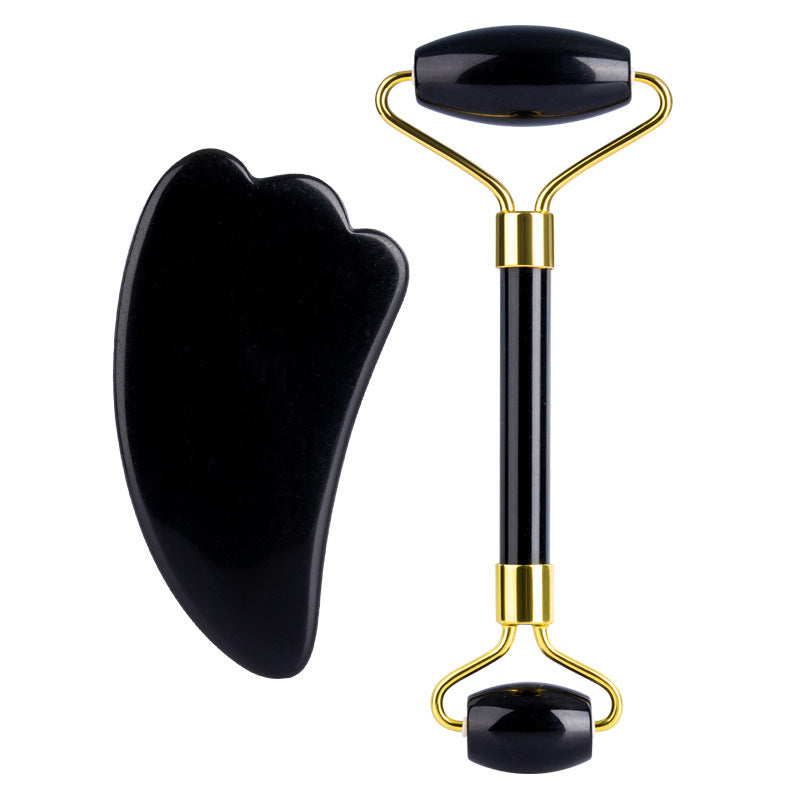 Black obsidian jade roller and gua sha set displayed side by side – ideal for natural facial massage and self-care rituals.