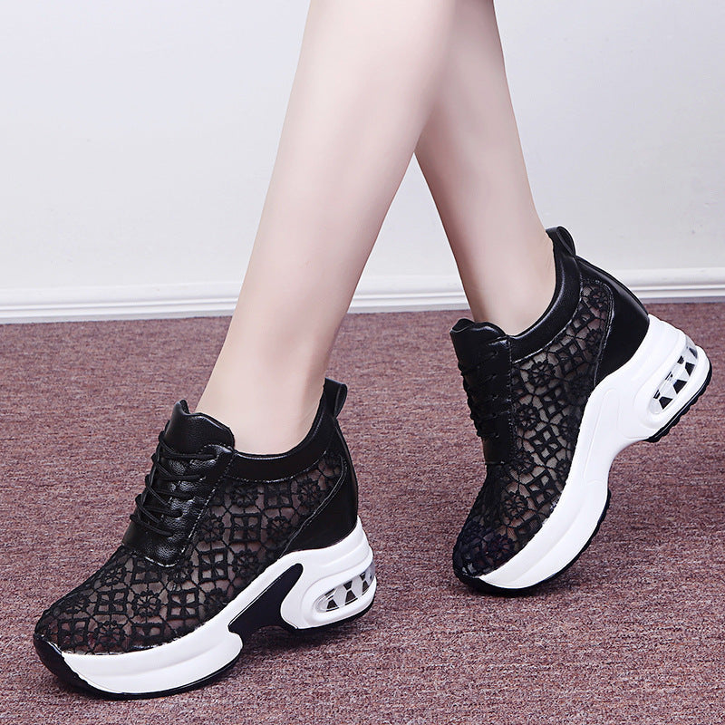 A Par of Black casual sneakers with air mesh structure – women’s lightweight walking shoes.

