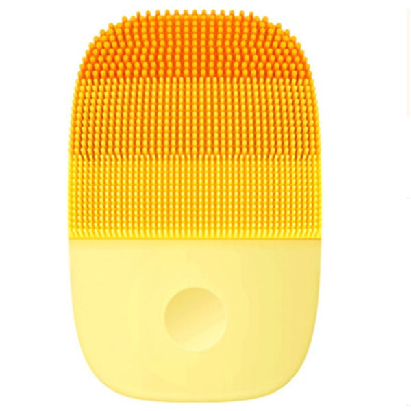 Orange silicone ultrasonic face brush with ergonomic design – deep pore cleansing tool.