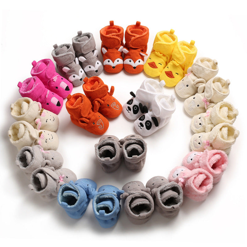 A pair of soft sole cotton baby shoes with a middle tube height, ideal for toddlers taking first steps in autumn and winter.