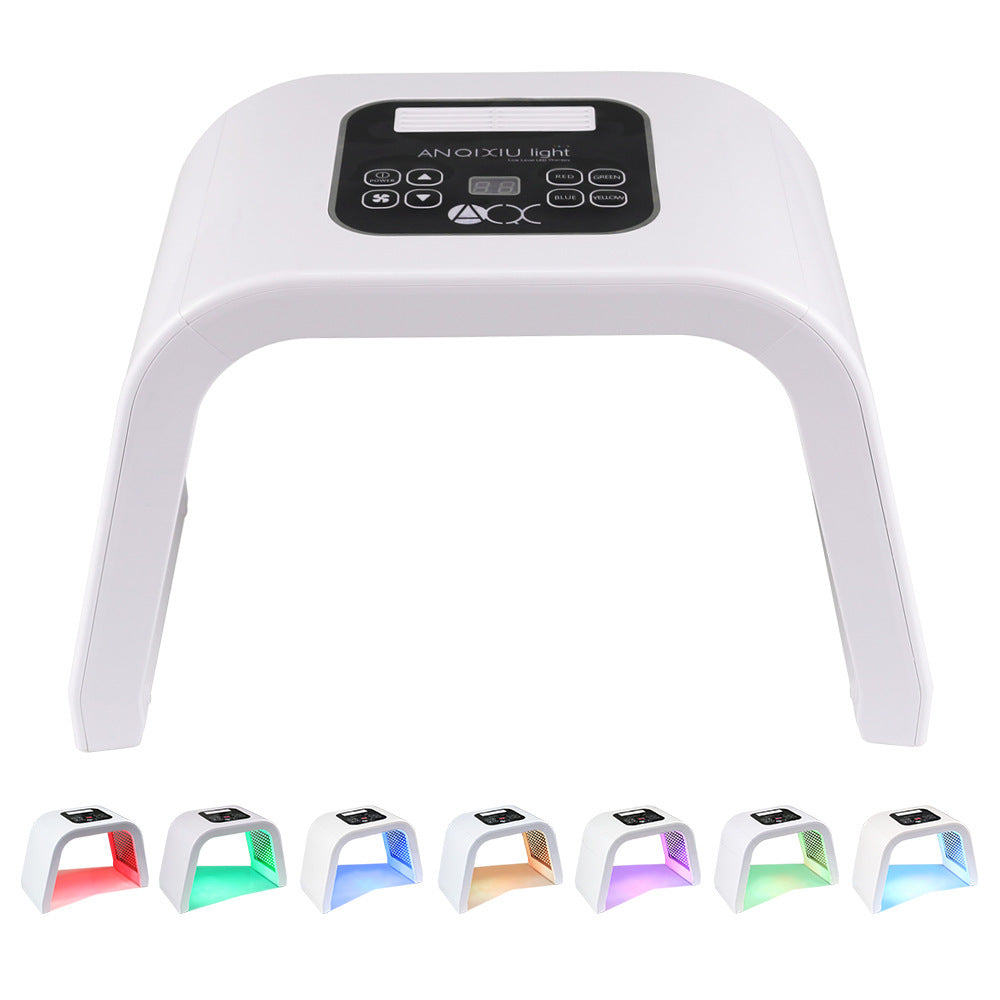 LED light therapy device with control panel, featuring seven light color modes for different skincare benefits, displayed on a white background.