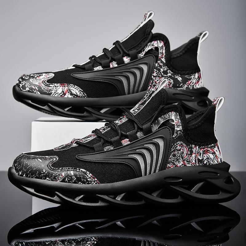 Black graffiti running shoes with abstract pattern and bold stripes