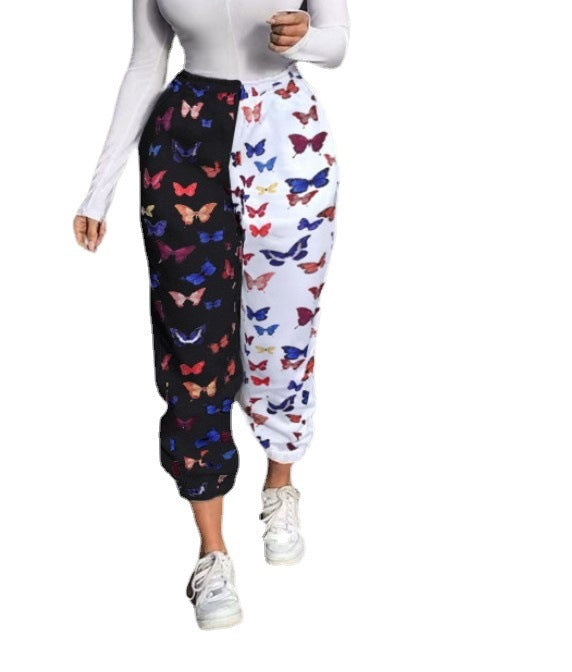 Woman doing yoga in printed activewear pants – stretch movement

