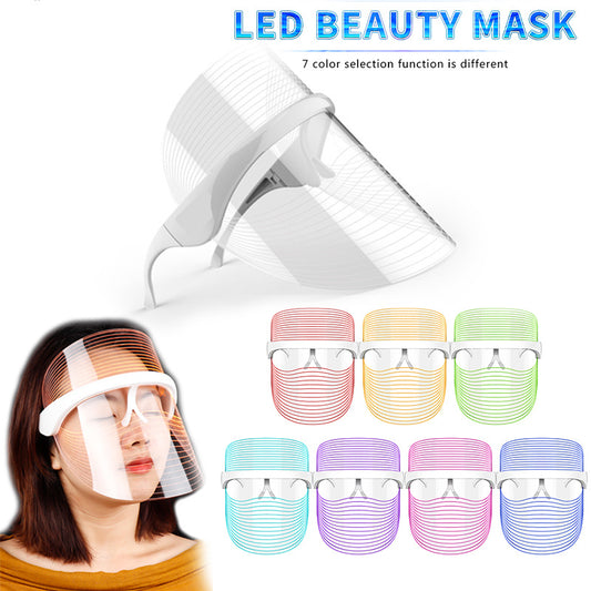"White 3-in-1 LED light therapy mask with red, blue and yellow modes for facial skincare, shown with USB charging port on clean background"