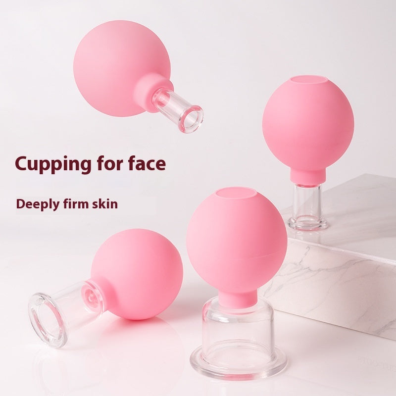 Box of 4 vinyl facial cupping massage tools in matching colour pink,  – used for lifting, sculpting and stimulating facial glow.