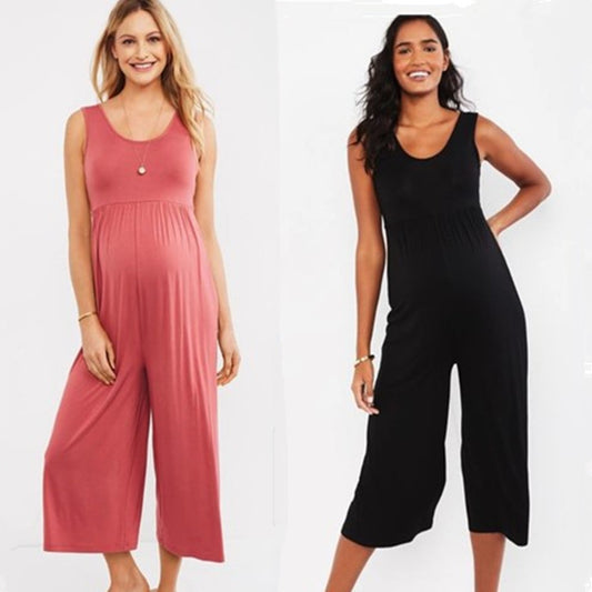 Two pregnant women wearing black and pink cropped wide-leg maternity jumpsuits
